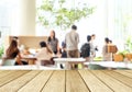 Empty wood perspective,table top, over blur group of people team Royalty Free Stock Photo