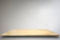 Empty wood shelf on cement wall background. Royalty Free Stock Photo