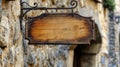 Empty Wood Sign Hanging on Textured Stone Wall in Outdoor Setting During Daytime Royalty Free Stock Photo