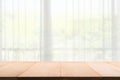 Empty of wood table with Blur of curtain window from green garden view in morning background Royalty Free Stock Photo