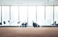 Empty wood table with blur room office and window city view