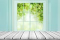 Empty wood table with blur window on green bokeh background. Royalty Free Stock Photo