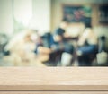 Empty wood table and blurred cafe with bokeh background