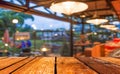 Empty wood table and Coffee shop blur background with bokeh image