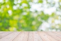 Empty wood table on green natural background in the garden outdoor. Mock up for your product display or montage Royalty Free Stock Photo