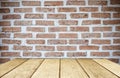 Empty wood table over brick wall background, product display