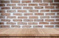 Empty wood table over brick wall background, product display Royalty Free Stock Photo