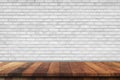 Empty wood table over white brick wall background, product montage display background Royalty Free Stock Photo