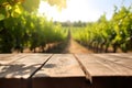 Empty wood table in a sunny vineyard, blurred background, ai generative illustration Royalty Free Stock Photo
