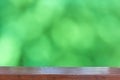 Empty wood table top on Abstract Blurred green bokeh background Royalty Free Stock Photo