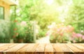 Empty wood table top on blur abstract green from garden Royalty Free Stock Photo