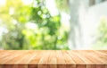 Empty wood table top on blur abstract green from garden and home area background Royalty Free Stock Photo