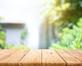 Empty wood table top on blur abstract green from garden and home area background Royalty Free Stock Photo