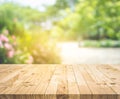 Empty wood table top on blur abstract green from garden and home area background Royalty Free Stock Photo