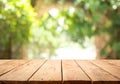 Empty wood table top on blur abstract green from garden and home area background Royalty Free Stock Photo