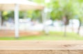 Empty wood table top on blur abstract green from garden and home area background Royalty Free Stock Photo