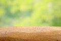 Empty wood table top on blur abstract green from garden and house in morning Royalty Free Stock Photo