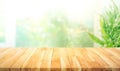 Empty wood table top on blur abstract green garden from window kitchen in the morning Royalty Free Stock Photo