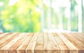 Empty wood table top on blur abstract green garden from window view background Royalty Free Stock Photo
