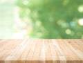 Empty wood table top on blur abstract green garden from window view Royalty Free Stock Photo