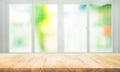 Empty wood table top on blur abstract green garden from window view Royalty Free Stock Photo