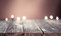 Empty wood table top and blur background, selective focus with Christmas lights. For montage product display Royalty Free Stock Photo