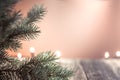 Empty wood table top and blur background, selective focus with lights and Christmas tree. For montage product display Royalty Free Stock Photo