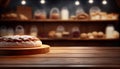 Empty wood table top on blur bakery shop or cafe restaurant with abstract bokeh background Royalty Free Stock Photo