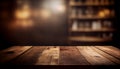 Empty wood table top on blur bakery shop or cafe restaurant with abstract bokeh background Royalty Free Stock Photo