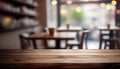 Empty wood table top on blur bakery shop or cafe restaurant with abstract bokeh background Royalty Free Stock Photo