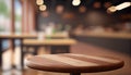 Empty wood table top on blur bakery shop or cafe restaurant with abstract bokeh background Royalty Free Stock Photo
