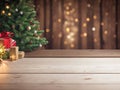 Empty wood table top with blur Christmas tree with bokeh light background Royalty Free Stock Photo