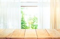 Empty of wood table top on blur of curtain window view Royalty Free Stock Photo