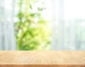 Empty of wood table top on blur of curtain with window view Royalty Free Stock Photo