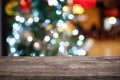 Empty wood table top and blur of glittering shine bulbs night li Royalty Free Stock Photo