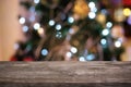 Empty wood table top and blur of glittering shine bulbs night li Royalty Free Stock Photo