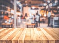 Empty wood table top on blur light bokeh in dark night cafe restaurant background Royalty Free Stock Photo