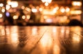 Empty wood table top bar on blur cafe restaurant in dark background Royalty Free Stock Photo