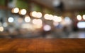 Empty wood table top and blur of night market background/selective focus .For montage product display.