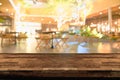 Empty wood table top and blur of night pub or restaurant background/selective Royalty Free Stock Photo