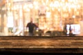 Empty wood table top and blur of night pub or restaurant Royalty Free Stock Photo