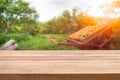 Wood table top with blur of orange garden in the morning.For mon Royalty Free Stock Photo