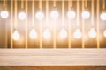 Empty wood table top and blur of Yellow bulb light and bokeh in Royalty Free Stock Photo