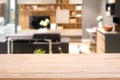 Empty wood table top with Blurred abstract mock up of modern living room interior Royalty Free Stock Photo