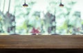 Empty wood table top with blurred cafe restaurant background. Mock up for display or montage of product,Business presentation Royalty Free Stock Photo