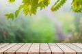 Empty wood table top and blurred green tree and vegetable in agricultural farms. background Royalty Free Stock Photo