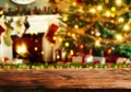 Empty wood table top on blurry bokeh Christmas tree and news year decoration. Concept Christmas time for web banner , display or Royalty Free Stock Photo