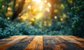 Empty wood table top on bokeh and blur abstract green background with golden lights. Product display template Royalty Free Stock Photo