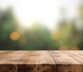 Empty wood table top with bokeh garden background Royalty Free Stock Photo