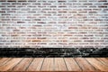 Empty wood table top and brick background with copy space. Royalty Free Stock Photo